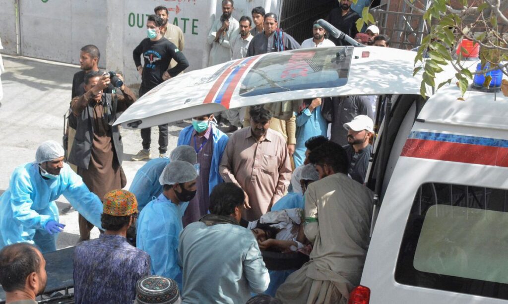 Men and paramedic staff transfer a man, who was injured in a blast in Mastung, from an ambulance outside hospital in Quetta. REUTERS