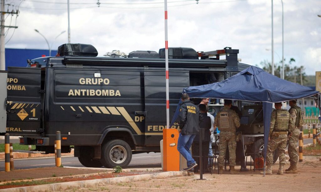 A robot of the federal police bomb squad is seen near what is believed to be an explosive artifact in Brasilia, Brazil