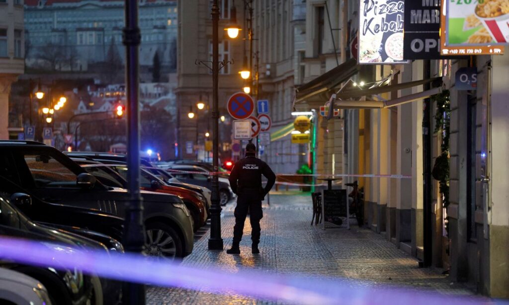 A police officer secures the area following the shooting at one of the buildings of Charles University in Prague, Czech Republic, December 21, 2023. REUTERS/David W Cerny