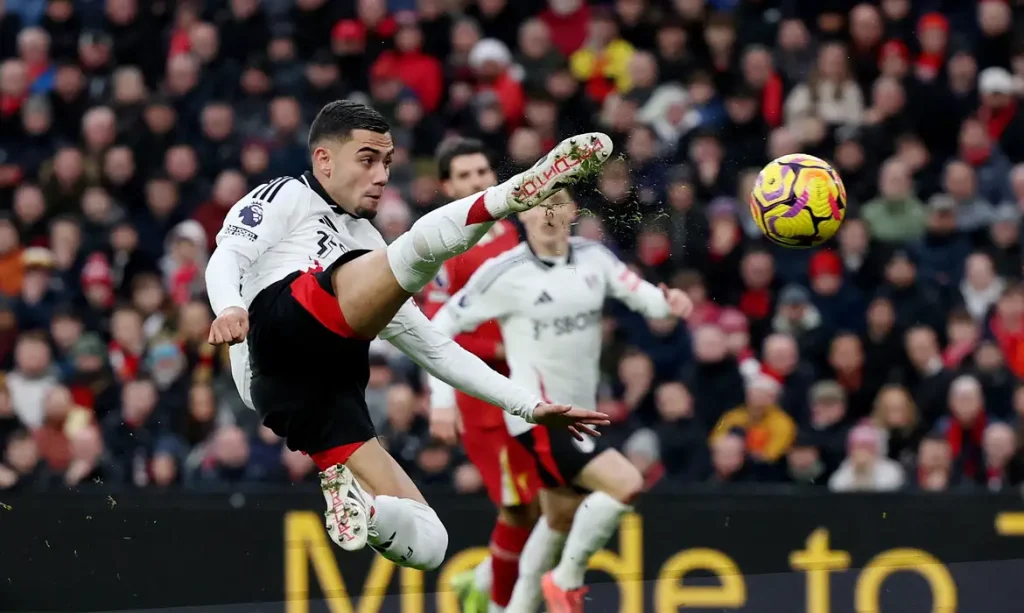 Soccer Football - Premier League - Liverpool v Fulham - Anfield, Liverpool, Britain - December 14, 2024 Fulham's Andreas Pereira scores their first goal REUTERS/Phil Noble EDITORIAL USE ONLY. NO USE WITH UNAUTHORIZED AUDIO, VIDEO, DATA, FIXTURE LISTS, CLUB/LEAGUE LOGOS OR 'LIVE' SERVICES. ONLINE IN-MATCH USE LIMITED TO 120 IMAGES, NO VIDEO EMULATION. NO USE IN BETTING, GAMES OR SINGLE CLUB/LEAGUE/PLAYER PUBLICATIONS. PLEASE CONTACT YOUR ACCOUNT REPRESENTATIVE FOR FURTHER DETAILS..     TPX IMAGES OF THE DAY