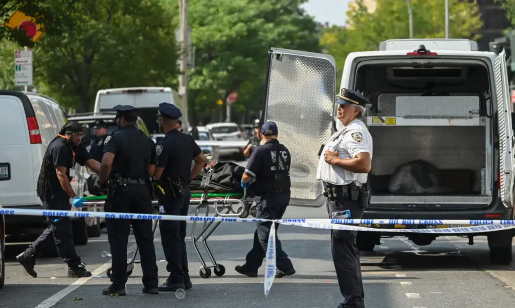 NEW YORK, UNITED STATES - AUGUST 17: Members of the New York City Office of the Chief Medical Examiner removed a man’s body from Taste of the City Bar and Lounge which is the site where three people were killed and eight other people were injured in a mass shooting inside of Taste of the City Bar and Lounge on Franklin Avenue in Crown Heights, Brooklyn, New York, United States on August 17, 2025. Three people were killed and eight others were wounded when multiple shooters opened fire inside Taste of the City Lounge at 903 Franklin Avenue in the Crown Heights neighborhood just before 3:30 a.m. The deceased are three men, who were 27, 35, and an unknown age. Eight others are at a local hospital. The body that was removed from the scene was a man who was shot and killed in the mass shooting. Kyle Mazza / AnadoluNo Use USA No use UK No use Canada No use France No use Japan No use Italy No use Australia No use Spain No use Belgium No use Korea No use South Africa No use Hong Kong No use New Zealand No use Turkey