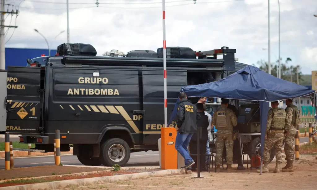 Security forces work as a robot of the federal police bomb squad is seen near what is believed to be an explosive artifact in Brasilia, Brazil, December 24, 2022. REUTERS/Adriano Machado