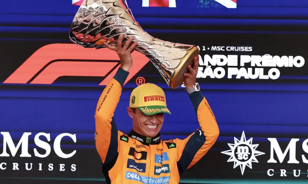 Formula One F1 - Sao Paulo Grand Prix - Autodromo Jose Carlos Pace, Sao Paulo, Brazil - November 9, 2025 McLaren's Lando Norris celebrates on the podium with a trophy after winning the Sao Paulo Grand Prix REUTERS/Jean Carniel