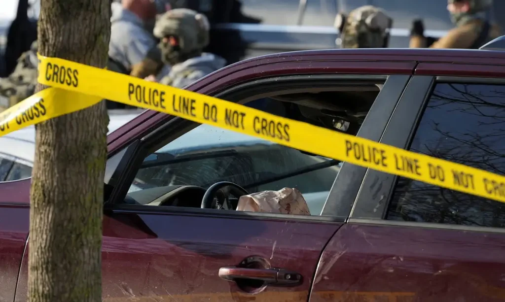Police tape surrounds a vehicle after its driver was shot by a U.S. immigration agent, according to local and federal officials, in Minneapolis, Minnesota, U.S., January 7, 2026. REUTERS/Tim Evans     TPX IMAGES OF THE DAY