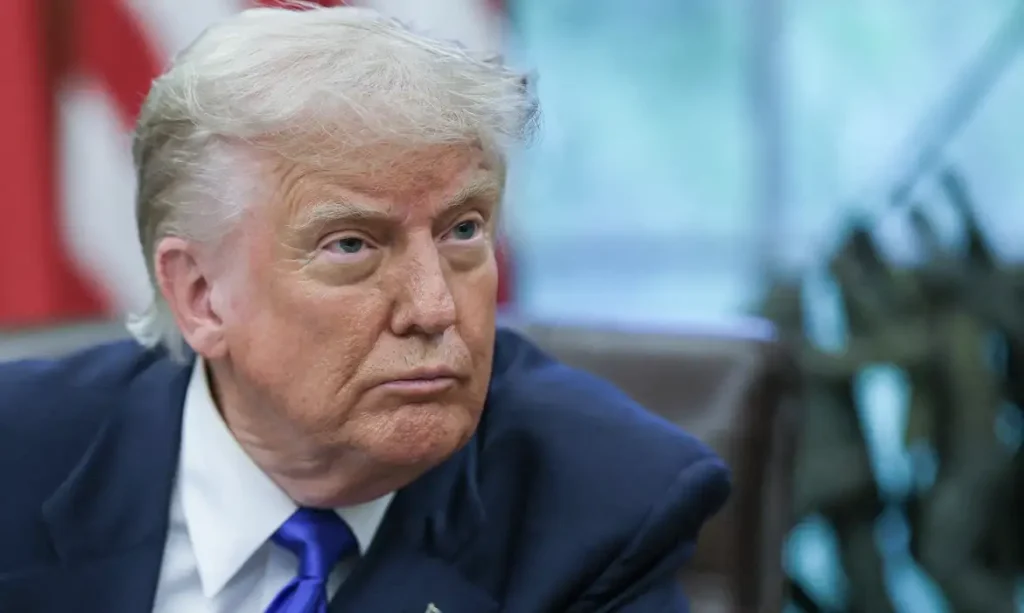 FILE PHOTO: U.S. President Donald Trump looks on as he signs executive orders and proclamations in the Oval Office at the White House, in Washington, D.C., U.S., May 5, 2025. REUTERS/Leah Millis/File Photo