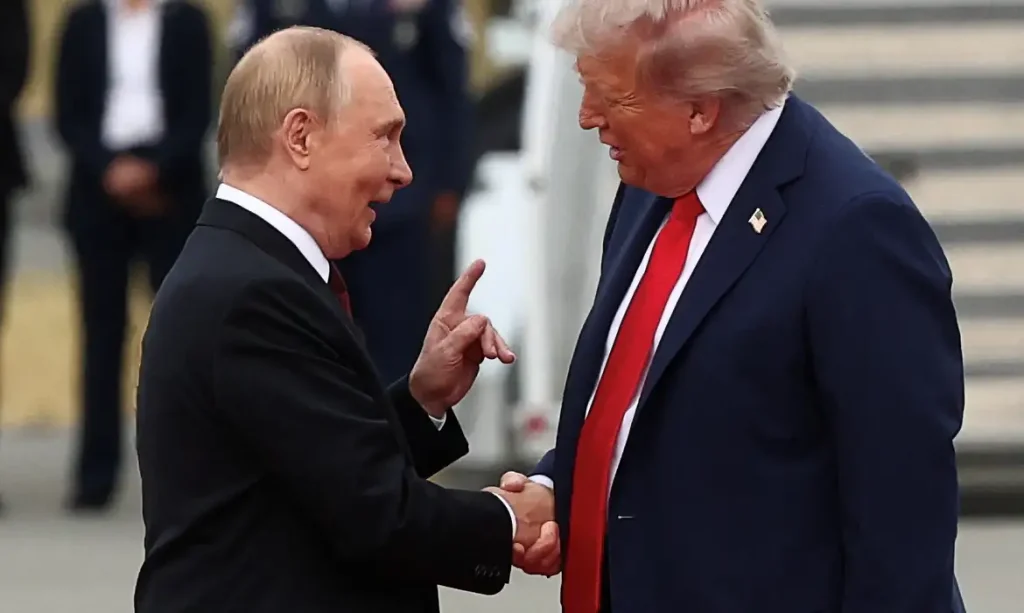 U.S. President Donald Trump shakes hand with Russian President Vladimir Putin, as they meet to negotiate for an end to the war in Ukraine, at Joint Base Elmendorf-Richardson in Anchorage, Alaska, U.S., August 15, 2025. REUTERS/Kevin Lamarque