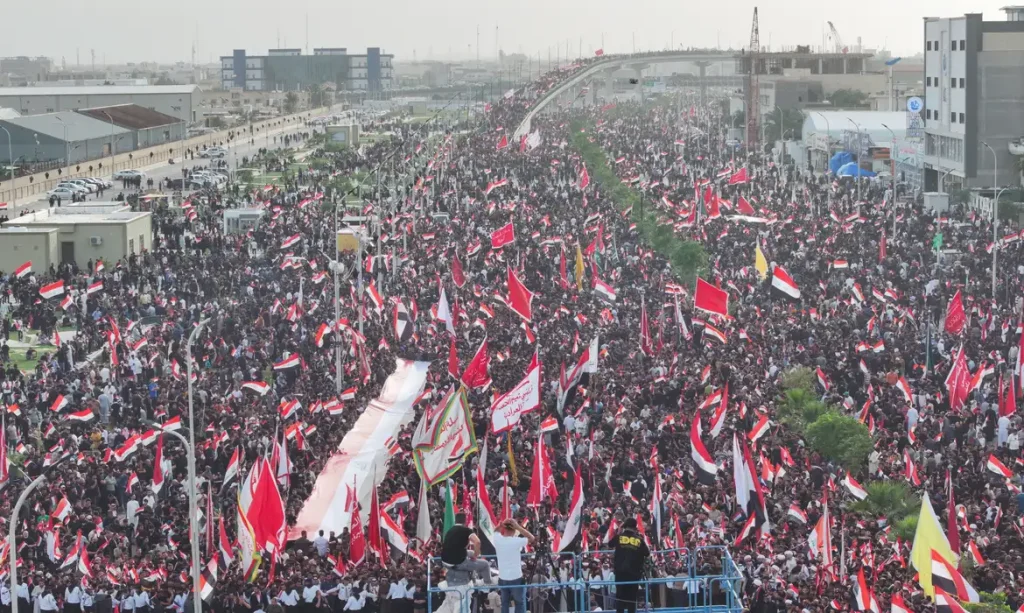 A drone view of supporters of Iraqi Shi'ite cleric Muqtada al-Sadr taking part in a peaceful protest against U.S. and Israeli actions in the region, amid the U.S.-Israeli conflict with Iran, in Basra, Iraq, April 4, 2026. REUTERS/Mohammed Aty
