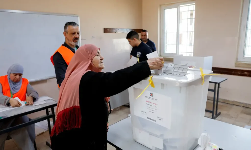 A Palestinian woman votes during the municipal council election, in Birzeit near Ramallah, in the Israeli-occupied West Bank, April 25, 2026. REUTERS/Mohammed Torokman