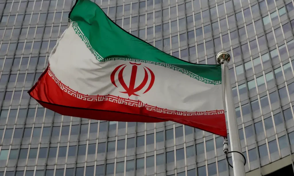 FILE PHOTO: An Iranian flag flutters in front of the International Atomic Energy Agency (IAEA) headquarters in Vienna, Austria September 9, 2019.   REUTERS/Leonhard Foeger/File Photo