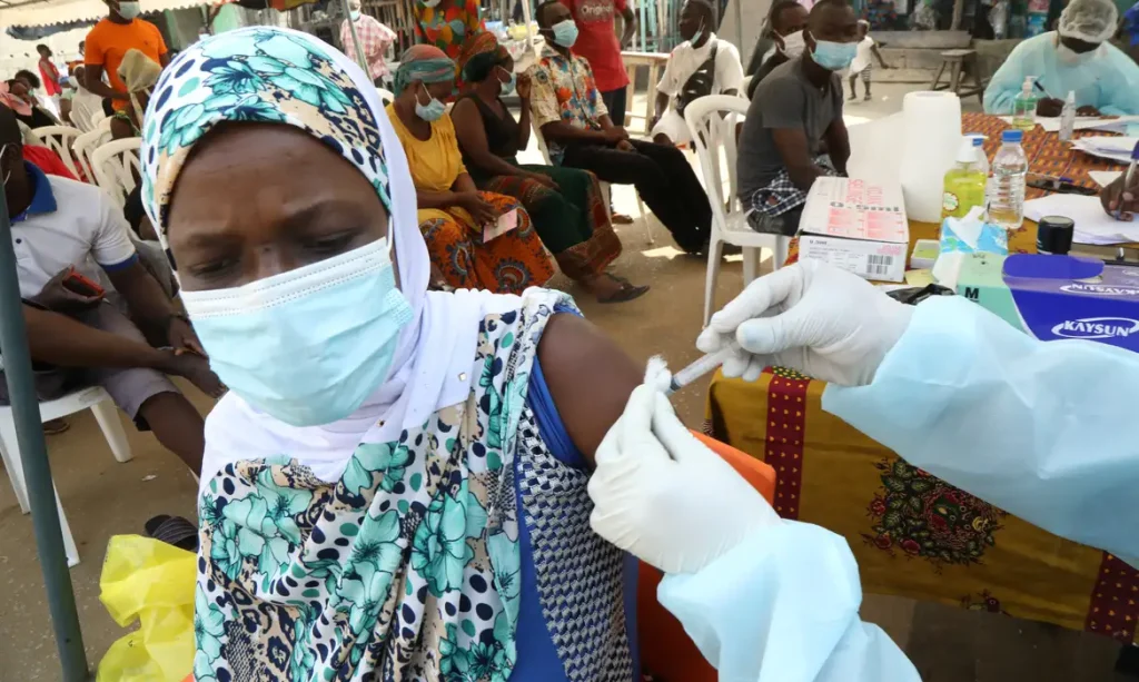 A resident receives a vaccine as the vaccinations against Ebola continue in Alakro, the slum where the first case of Ebola was confirmed, in Abidjan, Ivory Coast August 17, 2021. REUTERS/Luc Gnago