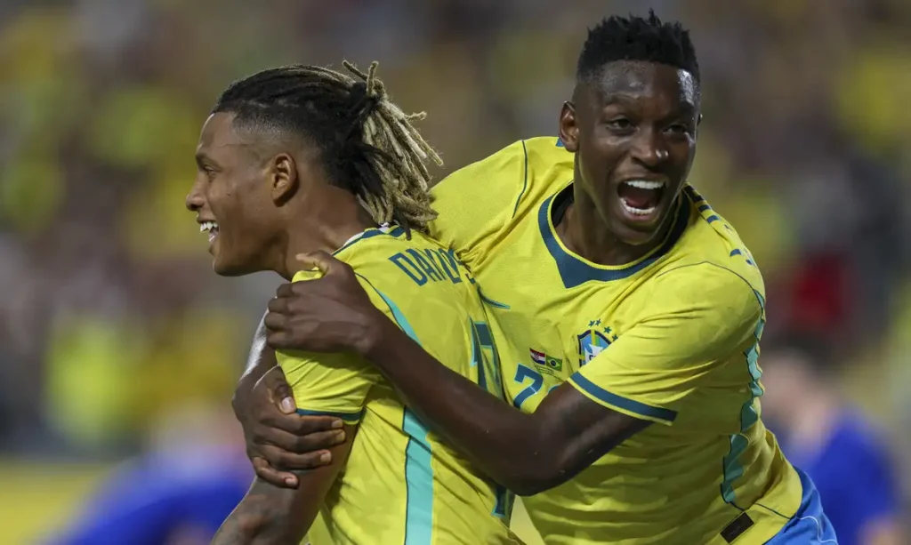 Mar 31, 2026; Orlando, Florida, USA; Brazil midfielder Danilo (18) reacts with forward Luiz Henrique (20) after scoring a goal against Croatia in the first half during an international friendly at Camping World Stadium. Mandatory Credit: Nathan Ray Seebeck-Imagn Images