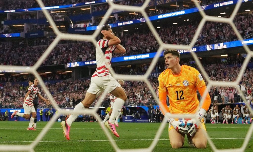 Soccer Football - FIFA World Cup 2026 - Group D - United States v Paraguay - Los Angeles Stadium, Inglewood, California, U.S. - June 12, 2026 Giovanni Reyna of the U.S. celebrates scoring their fourth goal as Paraguay's Orlando Gill looks dejected IMAGN IMAGES via Reuters/Kirby Lee