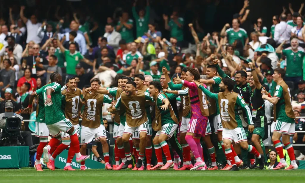 Soccer Football - FIFA World Cup 2026 - Group A - Mexico v South Africa - Estadio Azteca, Mexico City, Mexico - June 11, 2026 Mexico's Julian Quinones celebrates scoring their first goal with teammates REUTERS/Hannah Mckay     TPX IMAGES OF THE DAY