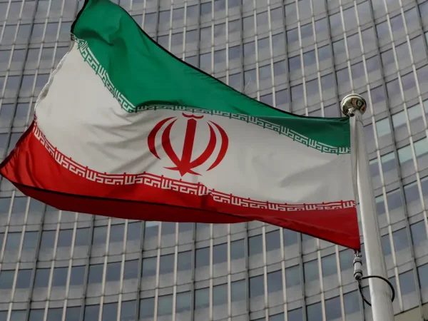 FILE PHOTO: An Iranian flag flutters in front of the International Atomic Energy Agency (IAEA) headquarters in Vienna, Austria September 9, 2019.   REUTERS/Leonhard Foeger/File Photo