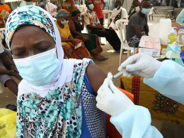 A resident receives a vaccine as the vaccinations against Ebola continue in Alakro, the slum where the first case of Ebola was confirmed, in Abidjan, Ivory Coast August 17, 2021. REUTERS/Luc Gnago