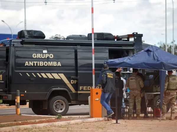 Security forces work as a robot of the federal police bomb squad is seen near what is believed to be an explosive artifact in Brasilia, Brazil, December 24, 2022. REUTERS/Adriano Machado