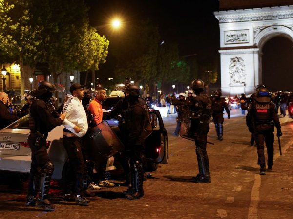 Police detain young people during the fifth night of protests following the death of Nahel, a 17-year-old teenager killed by a French police officer in Nanterre during a traffic stop, in the Champs Elysees area, in Paris, France, July 2, 2023. REUTERS/Juan Medina