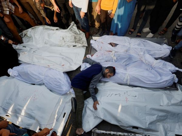 A mourner reacts amidst the bodies as people attend a funeral of Palestinians killed in Israeli strikes, amid the ongoing conflict between Israel and Palestinian Islamist group Hamas, in Khan Younis in the southern Gaza Strip, October 24, 2023. REUTERS/Mohammed Salem