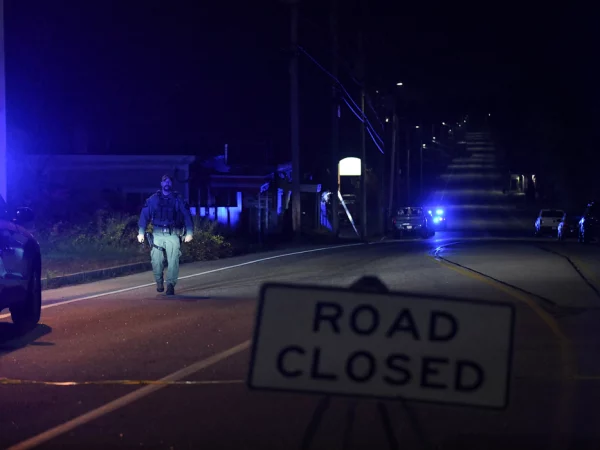 Police close Lincoln Street leading to Schemengees Bar & Grille Restaurant after deadly mass shootings in Lewiston, Maine, U.S. October 26, 2023.  REUTERS/Nicholas Pfosi
