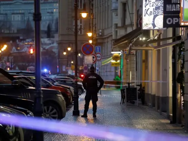 A police officer secures the area following the shooting at one of the buildings of Charles University in Prague, Czech Republic, December 21, 2023. REUTERS/David W Cerny
