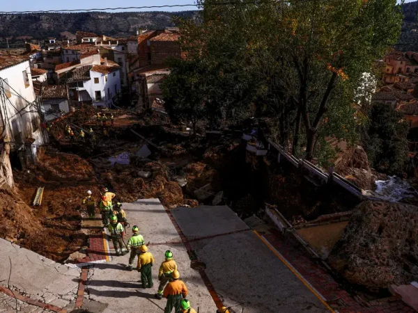Firefighters gather after heavy rains caused flooding, in Letur, Spain, October 30, 2024. REUTERS/Susana Vera