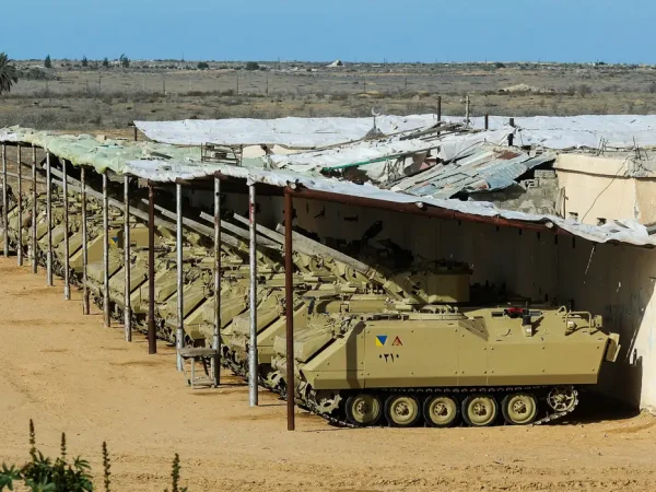 Egyptian military vehicles are parked, amid a ceasefire between Israel and Hamas, near the Rafah border crossing between Egypt and the Gaza Strip, in Rafah, Egypt January 19, 2025. REUTERS/Mohamed Abd El Ghany