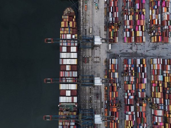 FILE PHOTO: A drone view shows a ship and containers at the Port of Santos, in Santos, Brazil April 3, 2025. REUTERS/Amanda Perobelli/Proibida reprodução