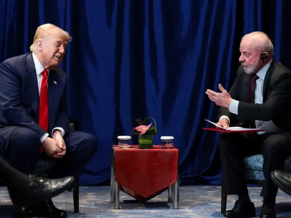 U.S. President Donald Trump and Brazilian President Luiz Inacio Lula da Silva talk as they meet on the sidelines of the 47th Association of Southeast Asian Nations (ASEAN) summit in Kuala Lumpur, Malaysia, October 26, 2025. REUTERS/Evelyn Hockstein