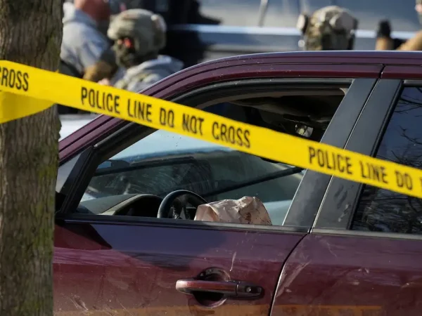 Police tape surrounds a vehicle after its driver was shot by a U.S. immigration agent, according to local and federal officials, in Minneapolis, Minnesota, U.S., January 7, 2026. REUTERS/Tim Evans     TPX IMAGES OF THE DAY