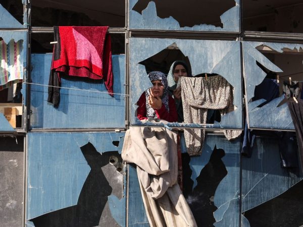 Palestinian women look on from behind broken windows, during the funeral of Palestinians who, according to medics, were killed by an Israeli strike on Saturday, at Al-Shifa Hospital in Gaza City, January 31, 2026. REUTERS/Dawoud Abu Alkas