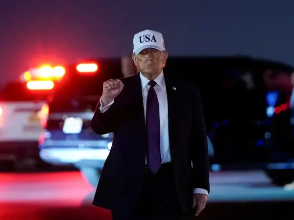 U.S. President Donald Trump pumps his fist after disembarking Air Force One at Palm Beach International Airport in West Palm Beach, Florida, U.S., February 27, 2026. REUTERS/Elizabeth Frantz