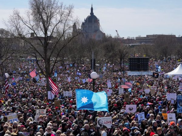 Demonstrators attend a