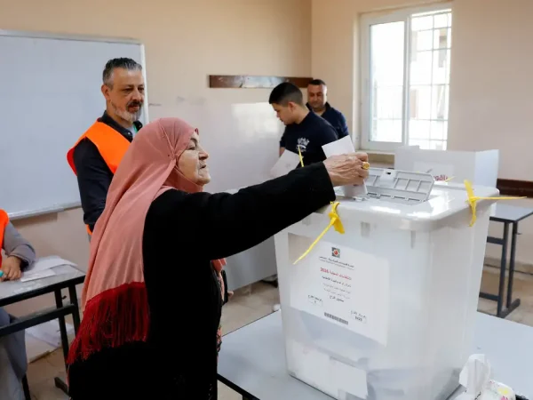 A Palestinian woman votes during the municipal council election, in Birzeit near Ramallah, in the Israeli-occupied West Bank, April 25, 2026. REUTERS/Mohammed Torokman