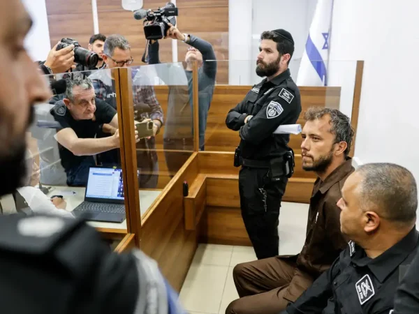 Activist Thiago Avila, a member of the Global Sumud Flotilla detained by Israel, sits at a magistrate's court to attend a detention extension hearing in Ashkelon, southern Israel, May 3, 2026. REUTERS/Amir Cohen