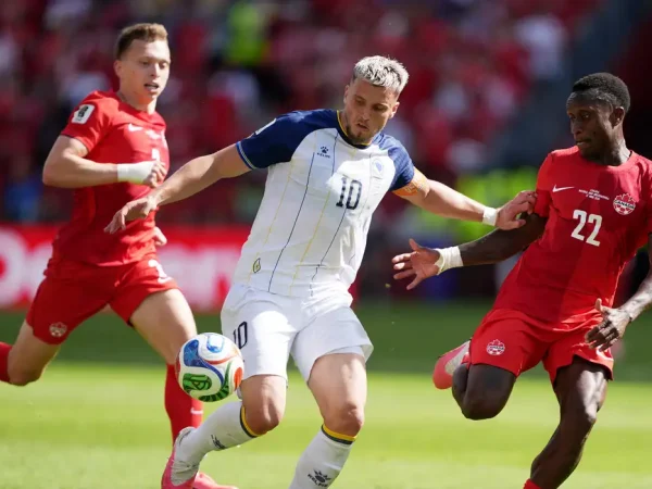 Soccer Football - FIFA World Cup 2026 - Group B - Canada v Bosnia and Herzegovina - Toronto Stadium, Toronto, Canada - June 12, 2026 Bosnia and Herzegovina's Ermedin Demirovic in action with Canada's Richie Laryea and Alistair Johnston IMAGN IMAGES via Reuters/John Sokolowski
