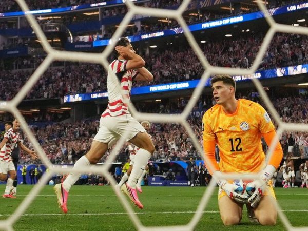 Soccer Football - FIFA World Cup 2026 - Group D - United States v Paraguay - Los Angeles Stadium, Inglewood, California, U.S. - June 12, 2026 Giovanni Reyna of the U.S. celebrates scoring their fourth goal as Paraguay's Orlando Gill looks dejected IMAGN IMAGES via Reuters/Kirby Lee