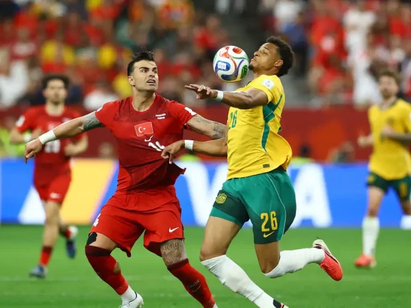 Soccer Football - FIFA World Cup 2026 - Group D - Australia v Turkey - BC Place, Vancouver, Canada - June 13, 2026 Australia's Tete Yengi in action with Turkey's Abdulkerim Bardakci REUTERS/Albert Gea