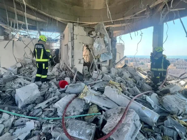 Bahrain civil defence and rescue personnel work in a residential building, which according to the Bahraini Interior Ministry, was hit by an Iranian drone, in Muharraq, Bahrain, June 28, 2026. Bahrain Police Media/Handout via REUTERS