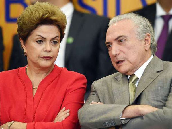 Ex-presidenta Dilma Rousseff e o atual presidente Michel Temer - (ARQUIVO / AFP PHOTO/EVARISTO SA)