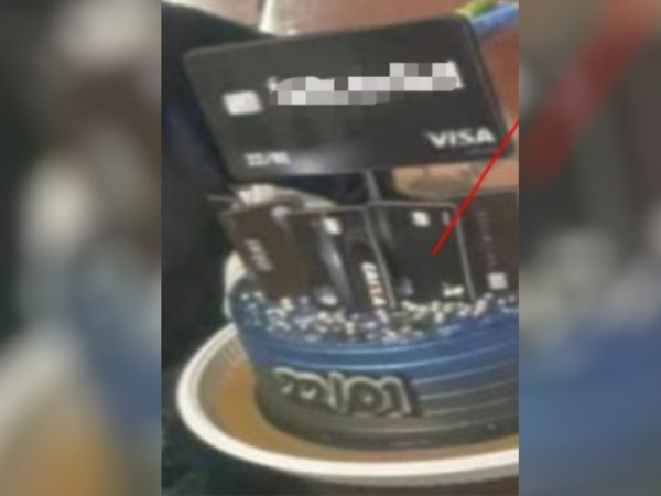 Casal preso suspeito de clonagem de cartões fez bolo de aniversário com o tema em Goianira, Goiás — Foto: Divulgação/Polícia Civil