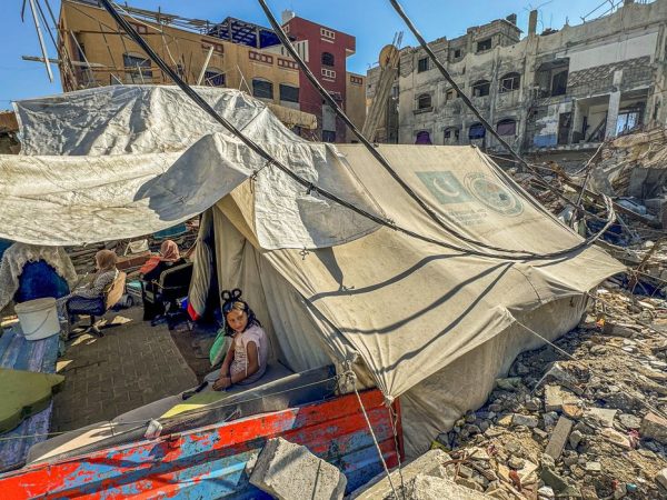 A displaced Palestinian girl, who fled her house due to Israel's military offensive, sits outside her family's tent, in Rafah, in the southern Gaza Strip May 13, 2024. REUTERS/Mohammed Salem